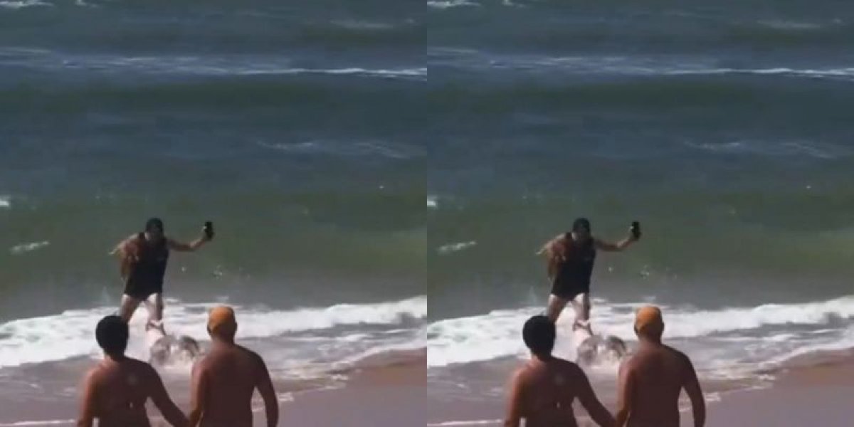 Homem se joga no mar para escapar de ataque de pit bull
