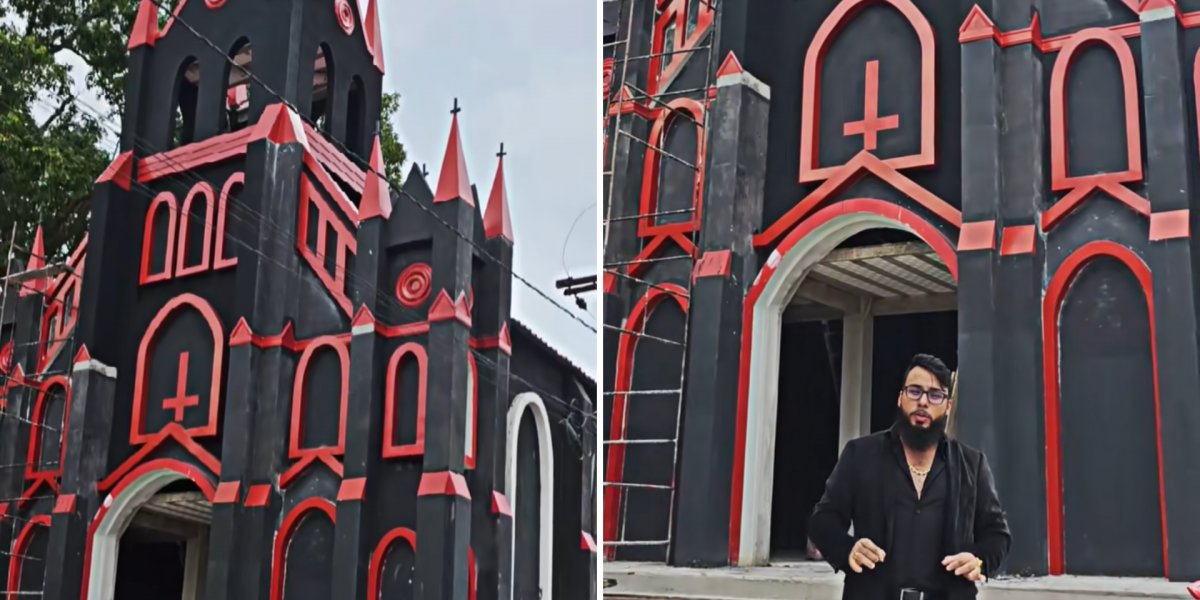 Igreja pintada de vermelho e preto e com cruzes de ponta-cabeça