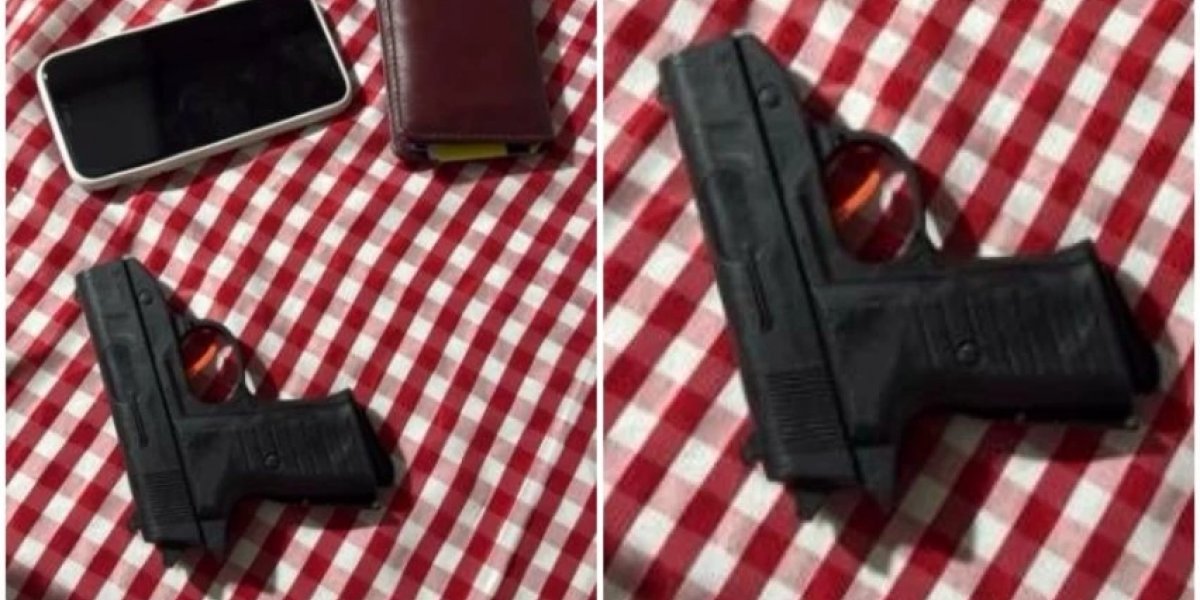 Arma apreendida com o suspeito