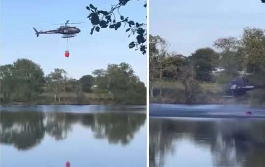 Helicóptero cai em lago após tentativa mal sucedida de pegar água para combater incêndio