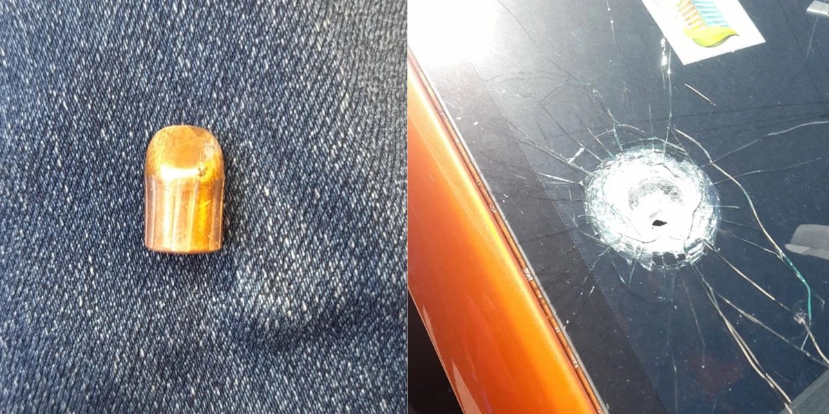 Resquício do projétil e para-brisa do carro quebrado