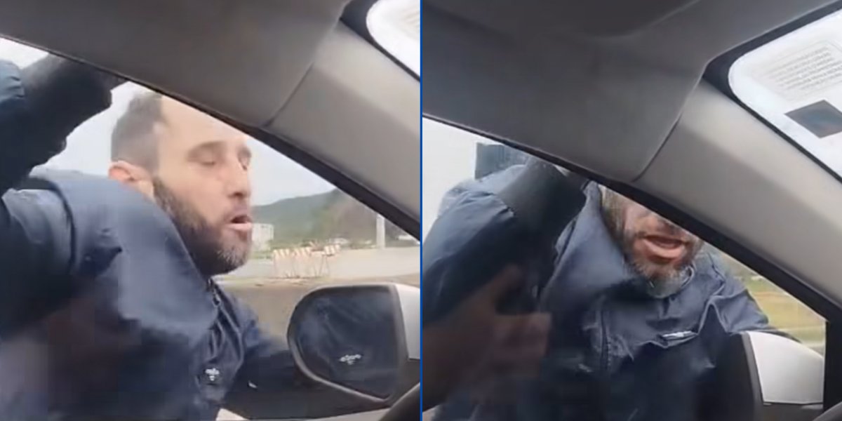 Homem tenta assaltar carro, mas fica pendurado na janela do veículo em movimento