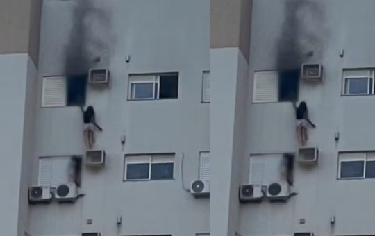 Mulher se pendura em suporte de ar-condicionado para resgatar mãe e criança durante incêndio em prédio