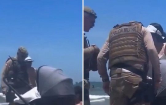 Polícia Militar orienta casal a tirar bebê do sol quente em praia de Balneário Camboriú