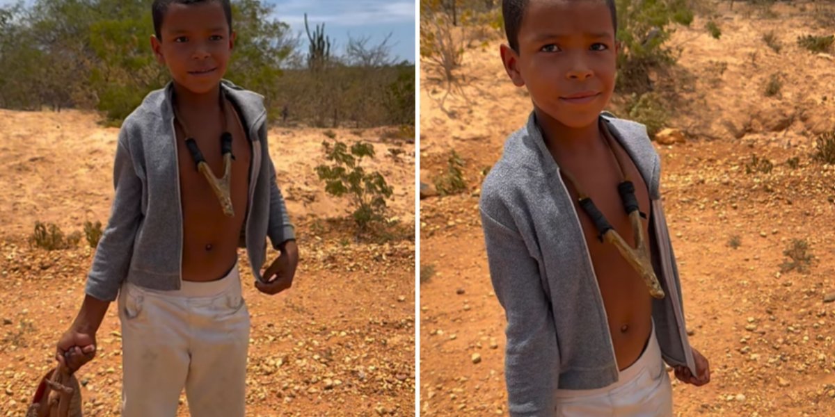 Menino com tatu na mão é surpreendido com R$ 300 para liberar animal e se alimentar