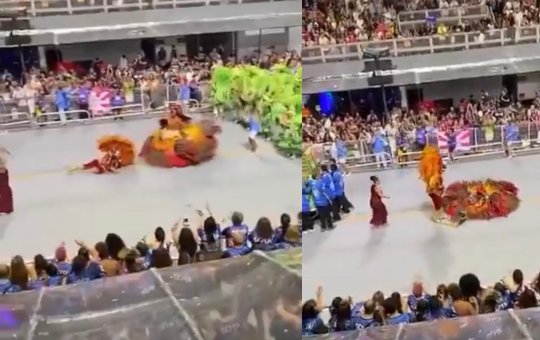 Casal de mestre-sala e porta-bandeira escorrega em óleo durante desfile no Sambódromo