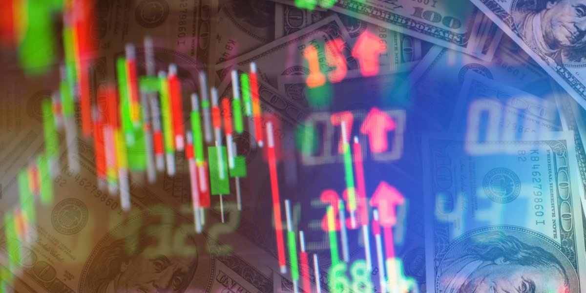 Notas de dólar e gráficos da bolsa de valores